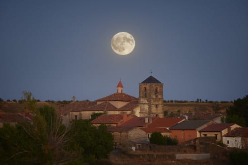 Full moon rising above a Spanish village church in Hiendelaencina, Casa Rural La Perla's scenic location