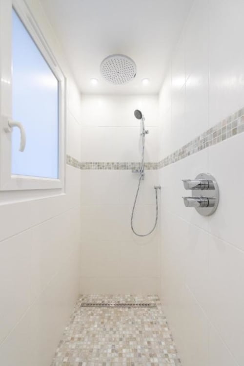 Modern walk-in shower with rainfall showerhead at Clos Céleste Campagne d'Etretat, Normandy B&B