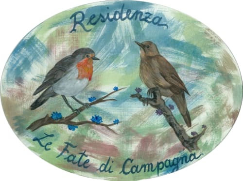 Two birds perched on a flowering branch, painted decoration for Residenza Le Fate di Campagna room in Assisi, Italy