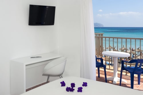 Modern hotel room at Sa Roqueta with sea view balcony overlooking Can Picafort beach and turquoise waters