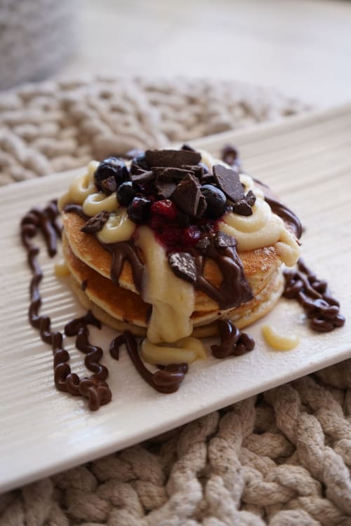 Dolce gourmet con scaglie di cioccolato e panna all'Hotel Sa Roqueta, Can Picafort