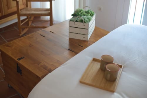 Zurraque Apartment dining table at La Casa De La Abuela Regina in Grazalema with wooden furnishings and potted herbs