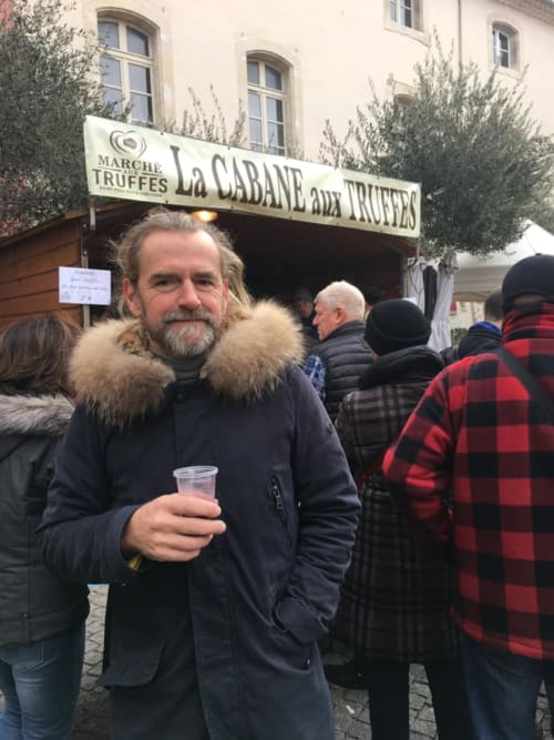 Man at truffle market in Grignan, France near Le Pavillon M