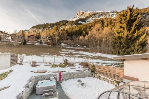 Snow-covered outdoor spa area with hot tub at Les Edelweiss Mont-Blanc, Passy, French Alps mountain views
