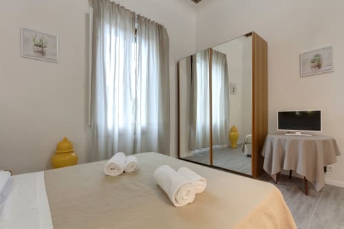 Bright Superior Apartment at Sleep tight Florence in Firenze with mirrored wardrobe, rolled towels, and modern amenities