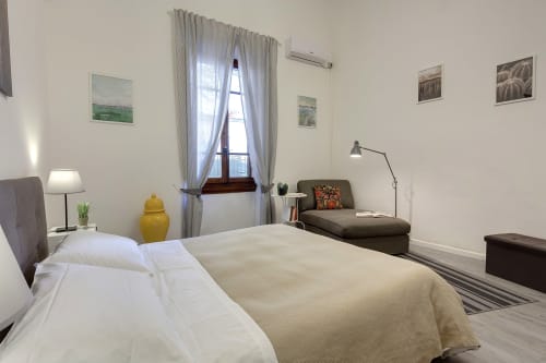 Bright bedroom at Sleep tight Florence B&B in Firenze with twin beds, garden view window, lounge area, and modern amenities