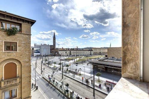 Panoramic city view from Sleep tight Florence suite overlooking Florence's historic plaza and architecture