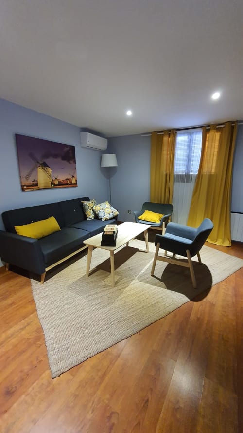 Zona de estar en vivienda de uso turístico Solano - Casa el Yelmo de Mambrino