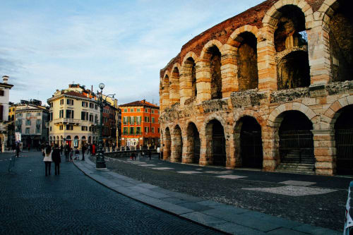 Ancient Roman amphitheater with terracotta buildings in Verona, Italy near Alloggio Le Casette