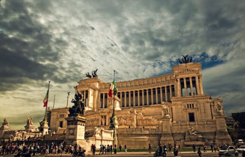 Monumental Roman architecture with equestrian statues and Italian flags, iconic landmark near Maison Vaticana Guest House