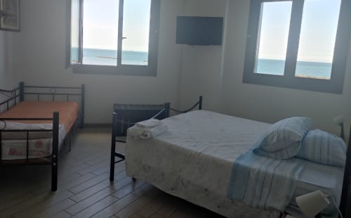 Triple room with private bathroom and shower. 1 double and 1 single bed. Sea view - B&B Pontemare in Collemarino, Ancona, Marche.