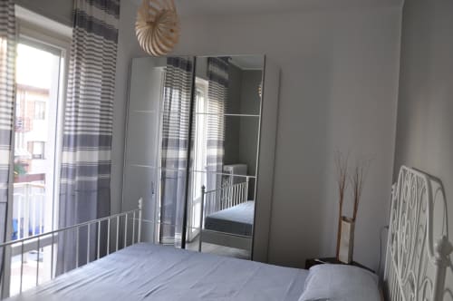 Double room Casa Marzi in Pesaro with wardrobe and balcony - near B&B Albornoz in Urbino, Marche.