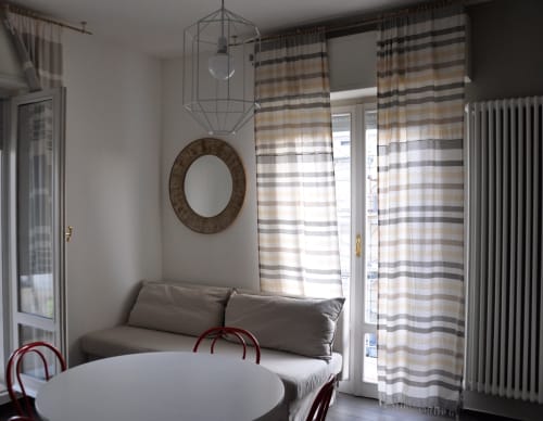 Casa Marzi in Pesaro with table and sofa in the living room - near B&B Albornoz in Urbino, Marche.