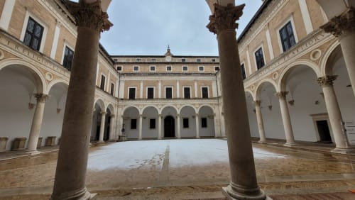 Historic Renaissance courtyard with ornate columns and arches at Covo del Pirata in Venice, Italy