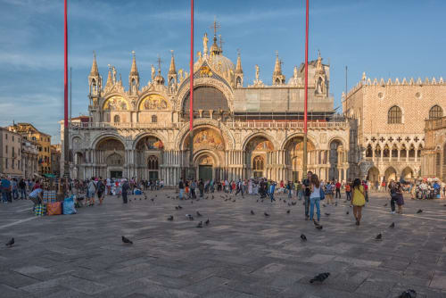 St. Mark's Basilica in Venice with tourists and pigeons in the square, near Covo del Pirata