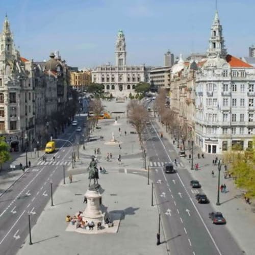1 minute walk. 

Aliados is the main avenue in the city center of Porto, Portugal. It is a wide boulevard that connects the City Hall to the São Bento train station. The avenue is lined with historic buildings, including the City Hall and the Stock Exchange Palace.

The avenue is also home to many important events and celebrations in Porto, such as the annual Sao Joao festival and the Christmas light show. It is a popular gathering place for locals and tourists alike, offering a variety of shops, restaurants, and cafes.

One of the most iconic features of Aliados is the statue of King Pedro IV, which stands at the center of the avenue. The statue was erected in the 19th century and is a symbol of the city's history and heritage.

Overall, Aliados is a vibrant and bustling area in the heart of Porto, offering a rich cultural experience for visitors. Also nearby all fancy hotels