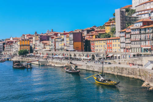 15 minutes walk. Ribeira is a historic neighborhood located along the banks of the Douro River in Porto, Portugal. It is known for its vibrant atmosphere and beautiful views of the river and the city. The area is filled with colorful houses and buildings, narrow cobblestone streets, and picturesque squares.

One of the main attractions in Ribeira is the Ribeira Square, a lively gathering spot where locals and tourists gather to enjoy the views and listen to live music. The square is also home to a number of restaurants and bars, serving up traditional Portuguese cuisine and drinks.

Another popular attraction in Ribeira is the Porto Wine Cellars, where visitors can learn about the history of port wine and taste different varieties. The area is also home to the São Francisco Church, a Gothic-style church with ornate interiors and a beautiful cloister.

Overall, Ribeira is a must-visit destination for anyone traveling to Porto, offering a unique blend of history, culture, and stunning views.