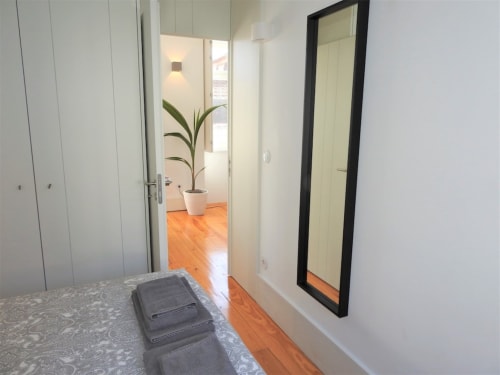 Apartment 1.3. Two-bedroom apartment with Sofa bed in livingroom. Suitable for 4 persons. Dining and seating area for 5 persons. HD Smart TV.  Located in historic center of Porto. At walking distance to most sceneries. Fully equipped kitchen with stove, oven, dishwasher, water cooker and Nespresso coffee machine (pads included). Cooling and heating by AC- Split unit.