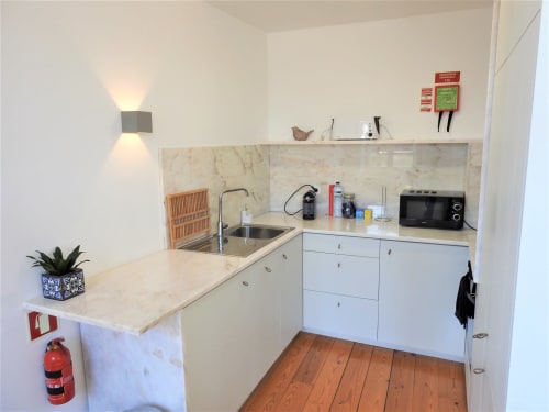 Apartment 1.3. Two-bedroom apartment with Sofa bed in livingroom. Suitable for 4 persons. Dining and seating area for 5 persons. HD Smart TV.  Located in historic center of Porto. At walking distance to most sceneries. Fully equipped kitchen with stove, oven, dishwasher, water cooker and Nespresso coffee machine (pads included). Cooling and heating by AC- Split unit.