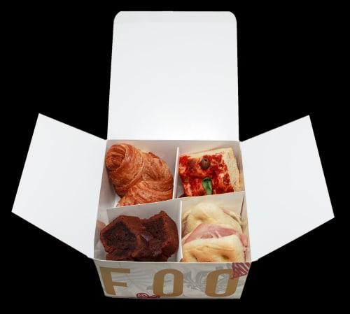 Assorted pastries and sandwiches in branded box at Maison Vaticana Guest House Rome breakfast service