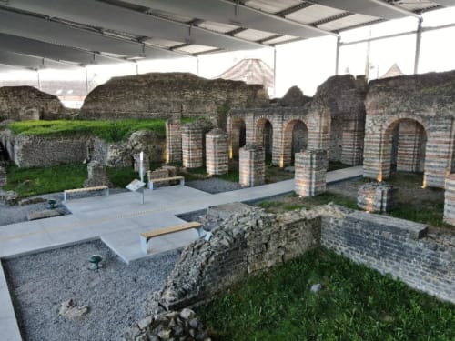 Roman ruins with brick columns under protective shelter at Le Grand Duc, Valenciennes