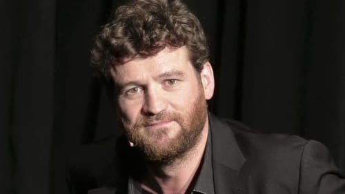 Man with beard in black blazer at Le Grand Duc boutique hotel, Valenciennes France