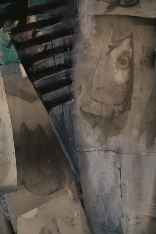 Concrete sculptural head detail in Le Grand Duc garden view room, Valenciennes