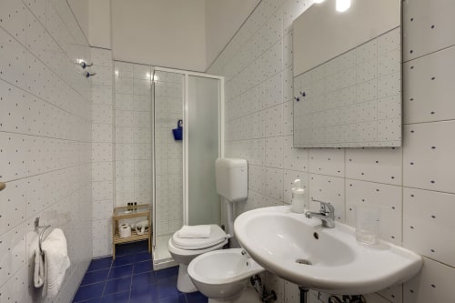 Private bathroom with shower, toilet, and sink in Sleep tight Florence ground floor apartment, Firenze