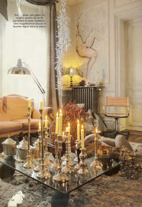 Elegant luxury suite at Le Grand Duc in Valenciennes with gold candelabra, crystal chandelier, and refined French decor