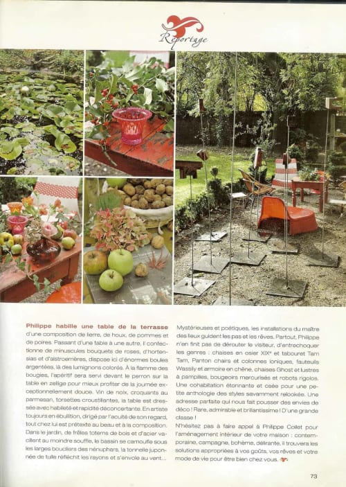 Elegant garden installation at Le Grand Duc BnB featuring red furniture, chairs, and decorative elements in Valenciennes