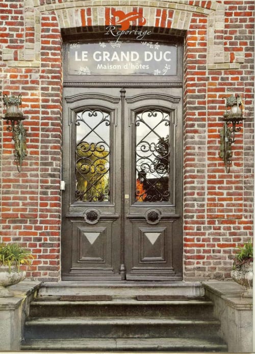 Elegant entrance door of Le Grand Duc bed and breakfast in Valenciennes, France