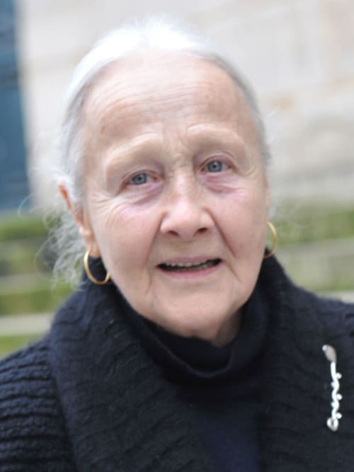 Elderly woman smiling at Le Grand Duc bed and breakfast in Valenciennes, France