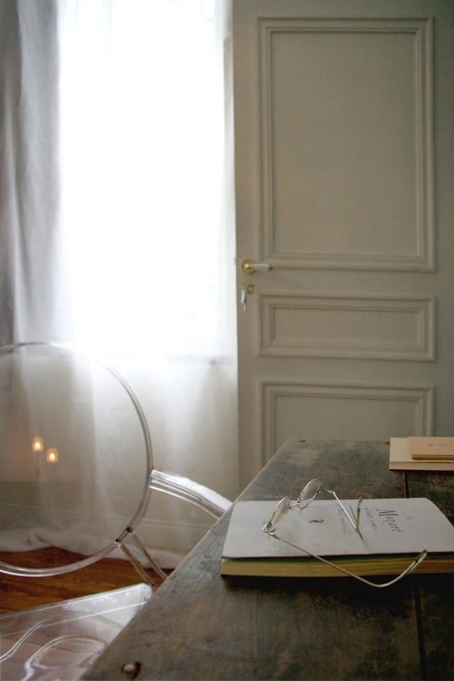 Elegant desk with reading glasses and notebook at Le Grand Duc B&B in Valenciennes, France