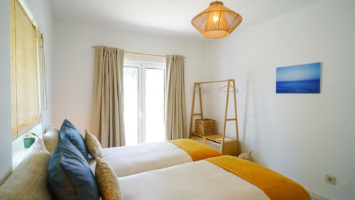 Roller room | Birds of Paradise - Unique, bright and beautiful en-suite bathroom, comfy twin bed, a chair, a closet with hangers, shelves and a private terrace in the garden