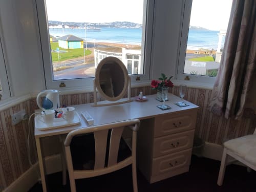 Beachfront dressing table at The Sands Hotel in Paignton with sea views through windows