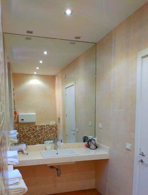 Modern bathroom at Stella CasaBono hotel in Sulmona with vessel sink, mosaic tile accents, and large mirror