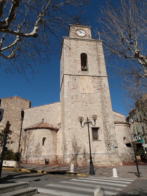 Historic stone church tower with clock in Ollioules, France near Saint Martin accommodation