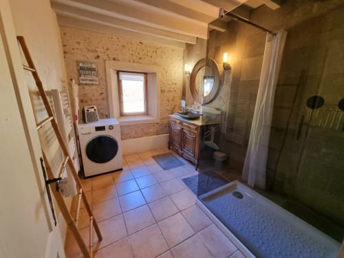 A large bathroom with washing machine