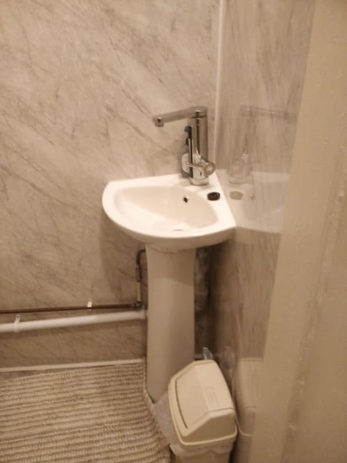 En-suite basin with electric tap