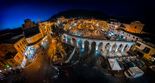 Stella CasaBono hotel night view, Sulmona historic center with illuminated Roman aqueduct and square