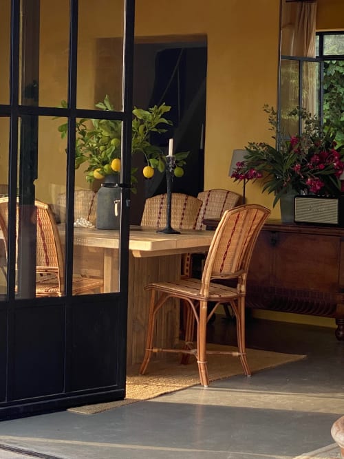 Saint Martin B&B Ollioules terrace with rattan chairs, lemon plant, and magenta flowers