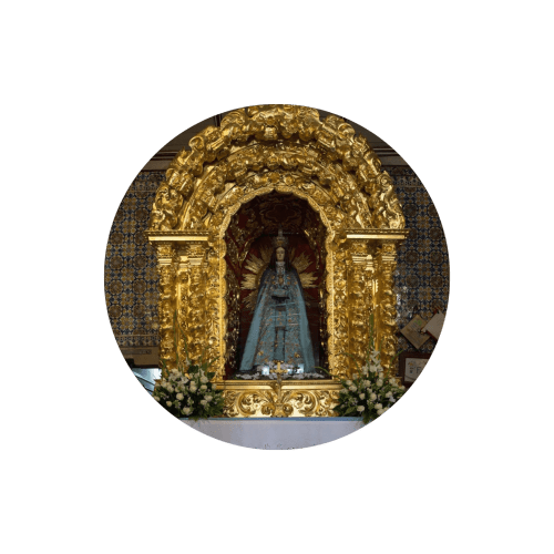 Golden ornate shrine with blue religious statue at Casa das Jardas rural hotel in Ladoeiro, Portugal
