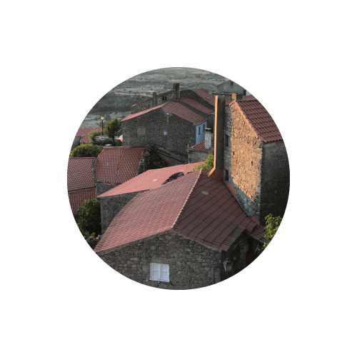 Aerial view of Casa das Jardas rural guesthouse with terracotta roofs in Ladoeiro, Portugal