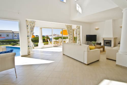spacious living room with pool view | AlbueraDomus Holiday Rentals - Beachside Retreat in Albufeira