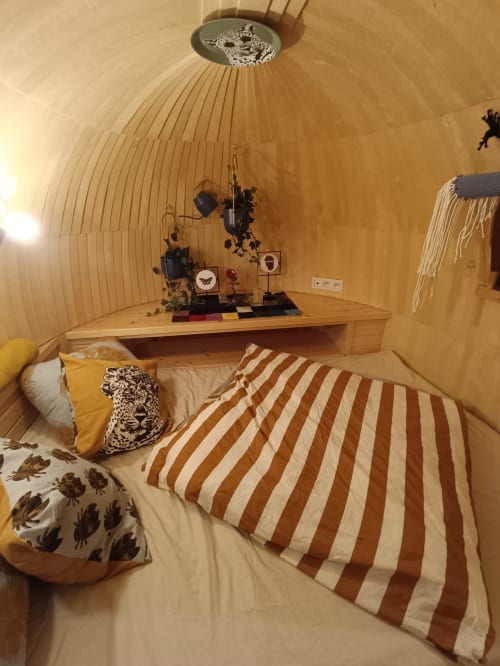 Casa LeopArt cottage bedroom with leopard-themed decor, wooden dome ceiling, striped bedding at Les Refuges Du Chalet, Jalhay