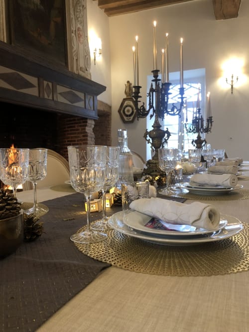 Elegant dining table at Le Prieuré Du Preux with crystal glasses, candelabra, and formal place settings in Sépeaux Saint