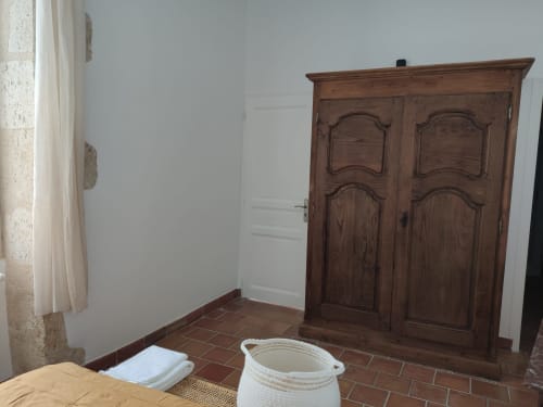 Traditional wooden wardrobe in the Cèdre room at Le Rêve d’Alice, authentic guesthouse in the Gers countryside