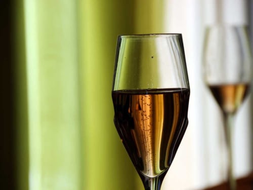 Champagne flute at Château De La Malmaison in Aÿ-Champagne, France. Sparkling wine celebration.