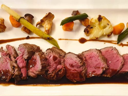 Sliced beef tenderloin with roasted vegetables and sauce at Château De La Malmaison, Aÿ-champagne