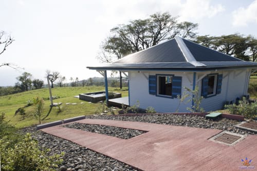 Kaz'Passiflora cottage at Le Domaine De L'ilet, Saint-Claude Guadeloupe, with terracotta patio and ocean views